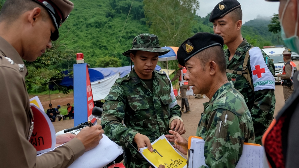 
Journalists and non-essential staff are ordered to leave the cave site and surrounding roads at the start of the rescue operation on Sunday [Linh Pham/Getty Images]
