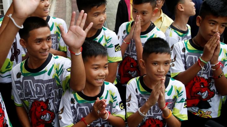 The soccer players and their coach who were rescued from a flooded cave arrive f