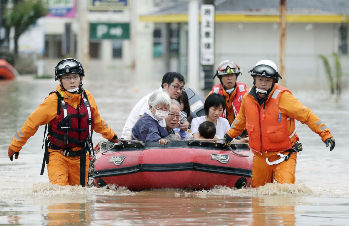 Local residents sit in a boat as they are rescued from a flooded area at a hospital in Kurashiki, Okayama Prefecture, Japan, in this photo taken by Kyodo July 8, 2018. Mandatory credit Kyodo/via REUTE