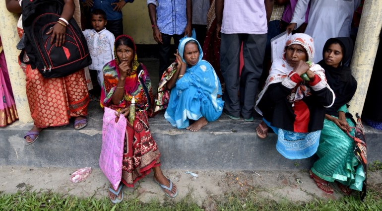 Villagers wait outside the National Register of Citizens (NRC) centre to get their documents verified by government officials, at Mayong Village in Morigaon district