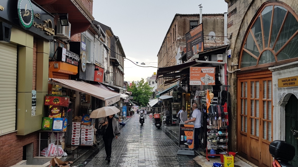 The shop signs in the area mostly in both Turkey and Arabic [Umut Uras/Al Jazeera]