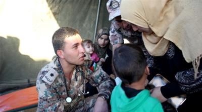 Injured Syrians receiving treatment at the border [Arwa Ibrahim/Al Jazeera]