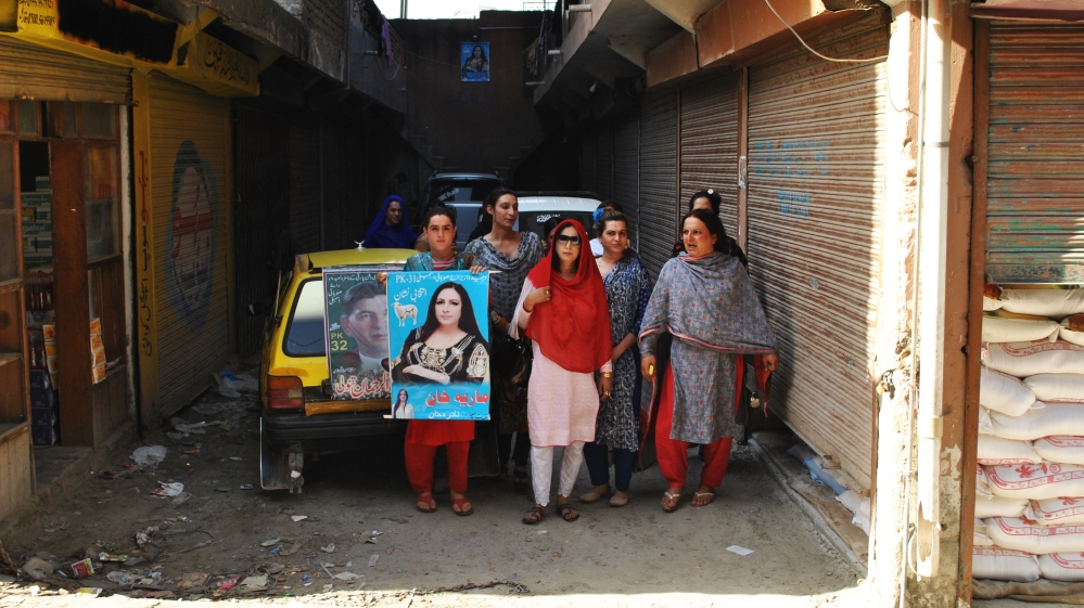 Despite challenges, Maria Khan continues her door-to-door campaigning in Khyber Pakhtunkhwa (KPK) province [Saba Rehman/Al Jazeera]