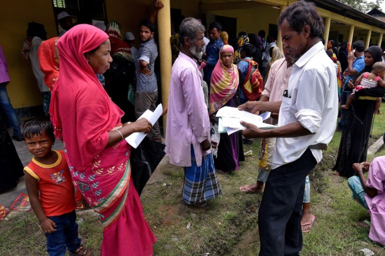 Villagers wait outside the National Register of Citizens (NRC) centre to get their documents verified by government officials, at Mayong Village in Morigaon district, in the northeastern state of Assa
