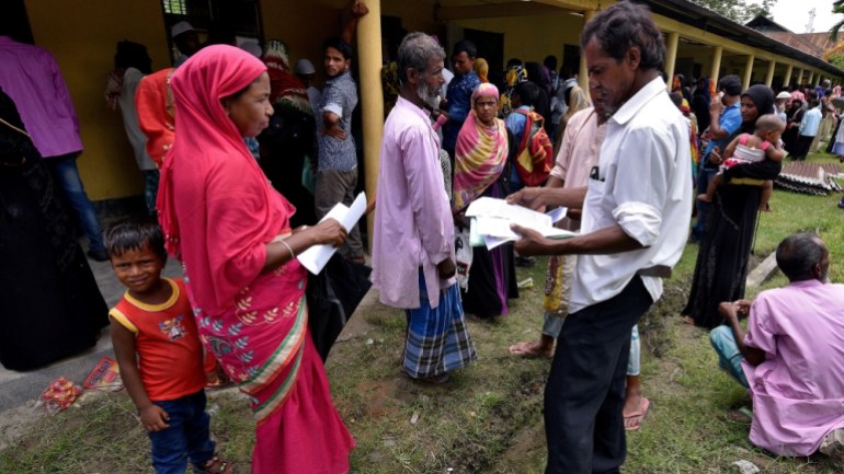 Villagers wait outside the National Register of Citizens (NRC) centre to get their documents verified by government officials, at Mayong Village in Morigaon district, in the northeastern state of Assa
