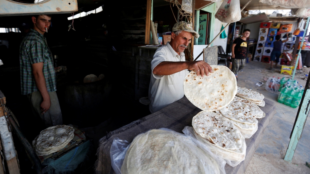 'We've lost our income,' merchants near the border say [Muhammad Hamed/Reuters]