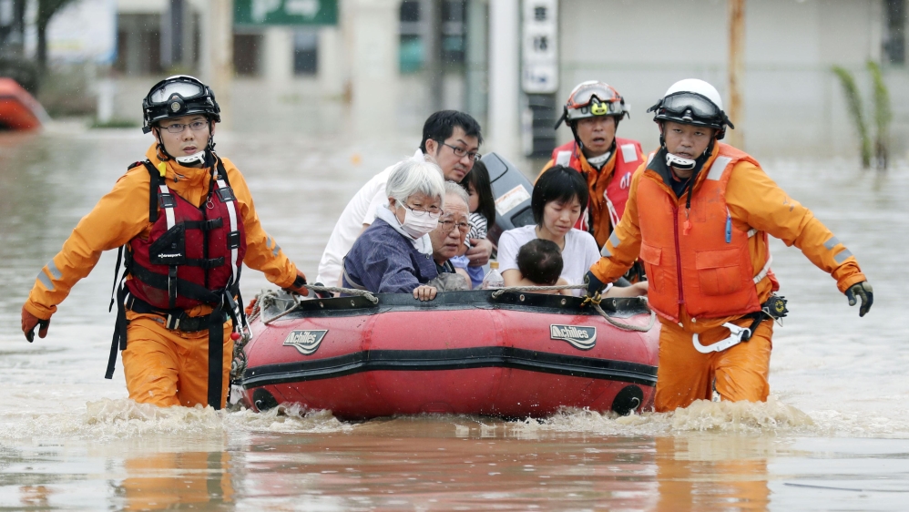 The torrential downpours have caused flash flooding and landslides [Kyodo via Reuters]