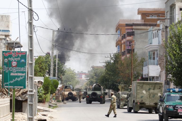 Smoke rises from an area where explosions and gunshots were heard, in Jalalabad city, Afghanistan July 28, 2018. [Parwiz/Reuters]