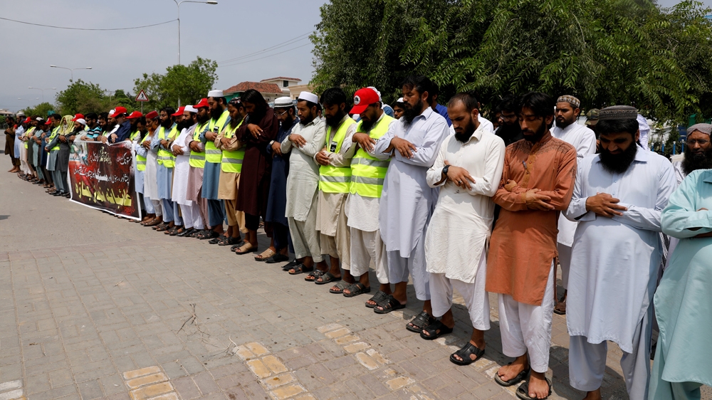 Supporters of the Jamaat-ud-Dawa Islamic organisation offered funeral prayers in absentia for the victims of Friday's suicide attack [Faisal Mahmood/Reuters]