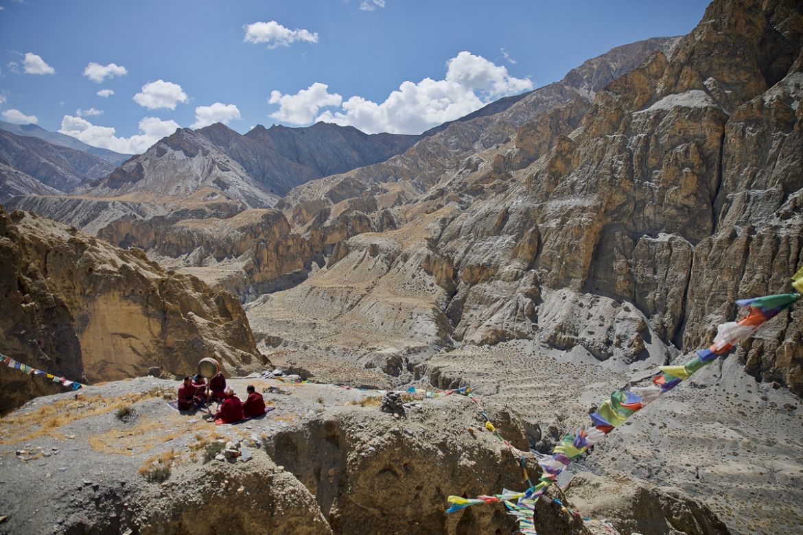11. Buddhist monks worship on a hilltop in Mustang, Nepal. With a rising number of thefts at monasteries in this remote region, monks are praying for greater protection of their Gods.
