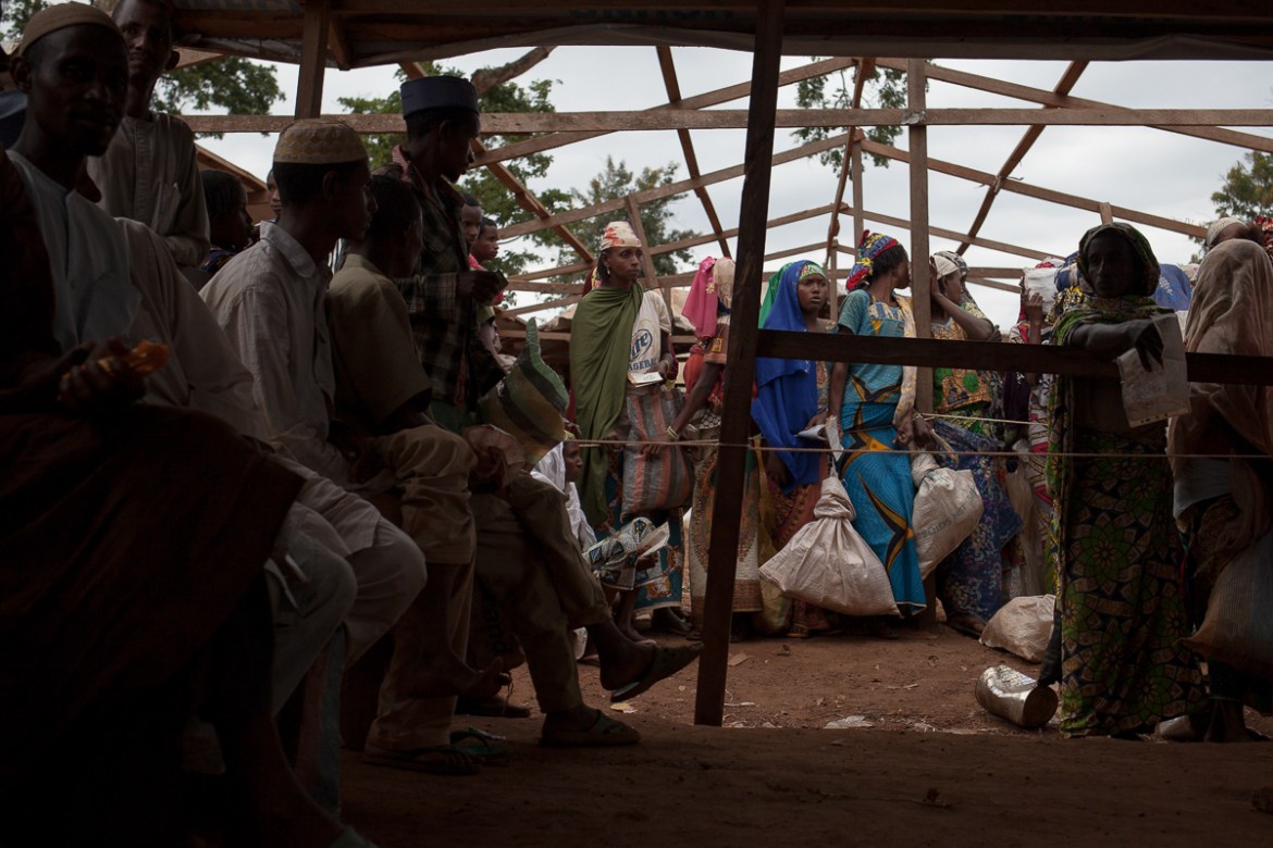 Central African refugees wait in line to receive their part from a food distribution, in the Mbile site. 13,000 refugees live there, for the most part since 2014. One of them, Sai¨dou Adjya, 47 years