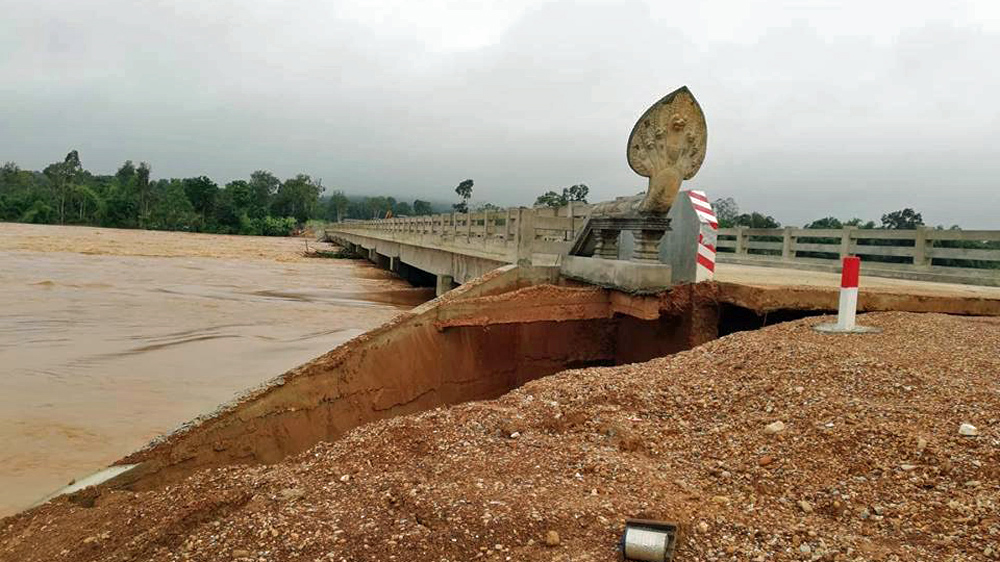 A 260-metre long concrete bridge across the Sekong River in Stung Treng province was damaged by floodwaters from Laos [Kry Solany/Al Jazeera]