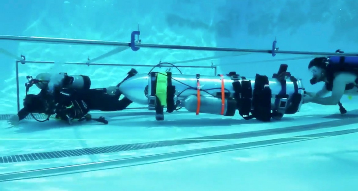 This frame grab from video tweeted by Elon Musk shows a "tiny kid-sized submarine" being tested in a pool at Palisades Charter High School, Sunday, July 8, 2018, in Pacific Palisades, Calif. Musk''s Sp