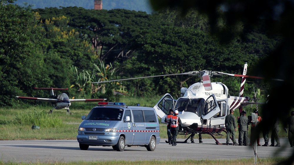 An ambulance carrying one of the rescued boys travels to a hospital from a military airport in Chiang Rai on July 9 [Athit Perawongmetha/Reuters]