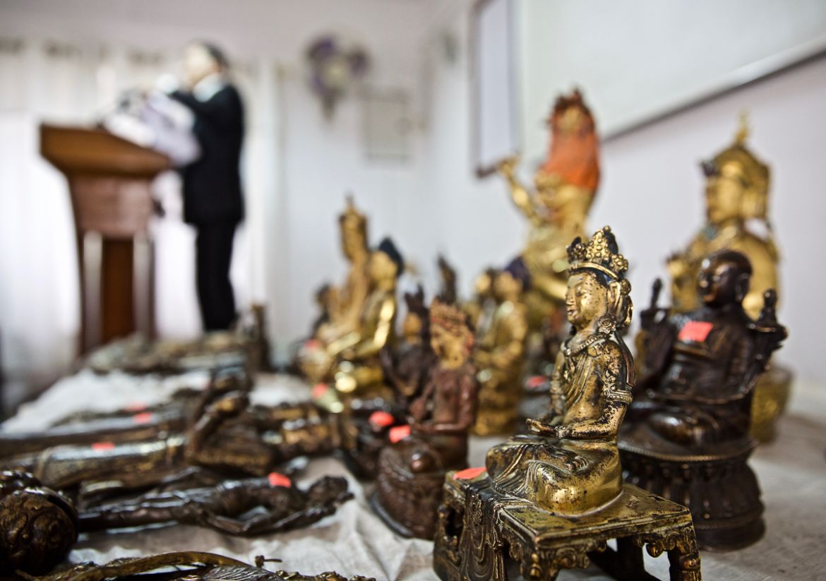 12. Authorities in Nepal hold a press conference displaying more than 100 antiquities seized in a raid of three antique shops in Kathmandu in May. The raid was initiated by information provided by 10