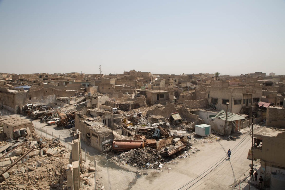 Photo 9 The neighbourhood of the Great Mosque of al-Nuri is totally flattened. One year on, residents of the area can’t return home as there is nothing waiting for them but debris. Photo: Tom Peyre-C