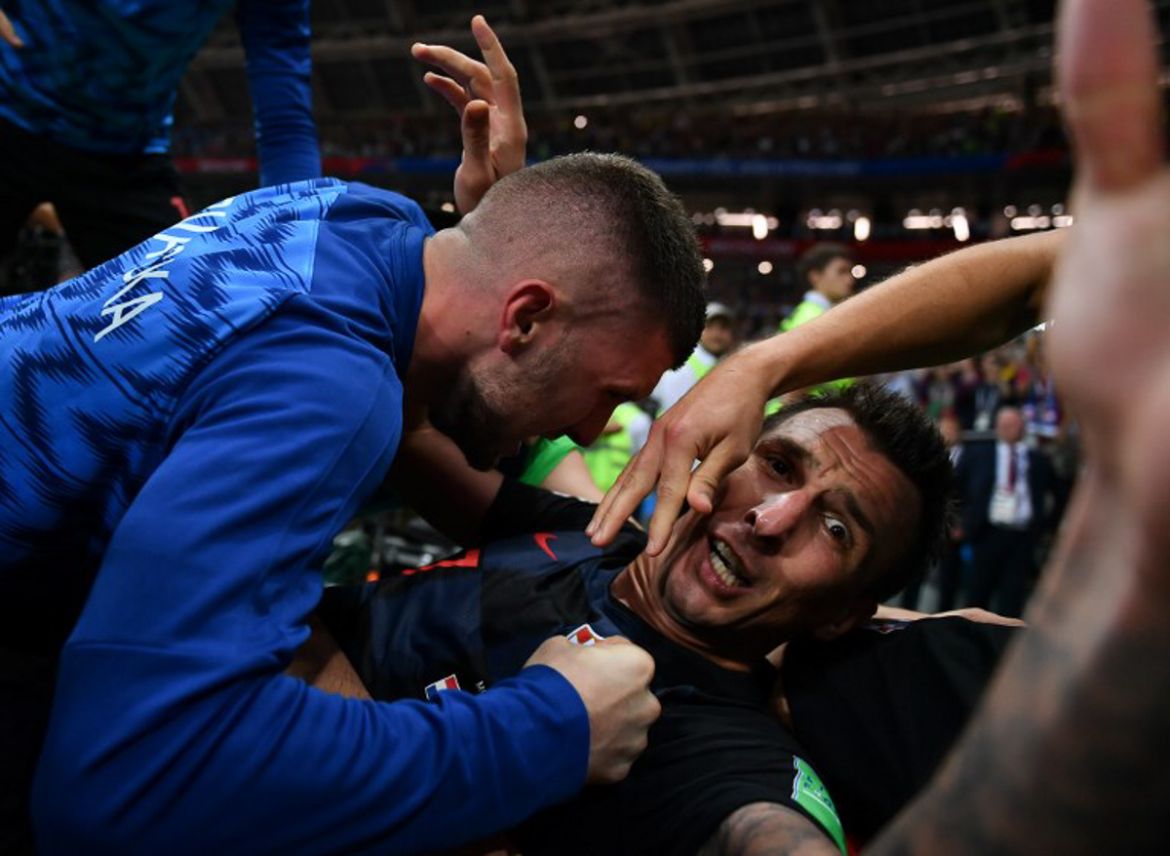 Croatia''s forward Mario Mandzukic (R) celebrates with teammates after scoring his team''s second goal during the Russia 2018 World Cup semi-final football match between Croatia and England at the Luzhn