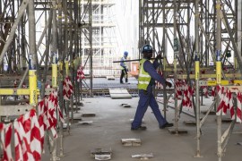 qatar 2022 labour migrant workers lusail stadium football