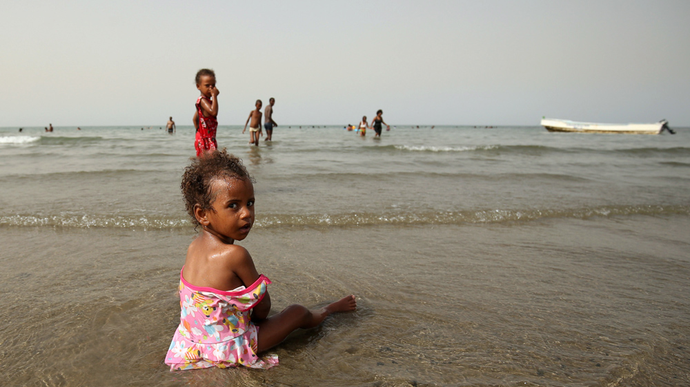 A girl plays at the beach in the port city of Massawa [Tiksa Negeri/Reuters]