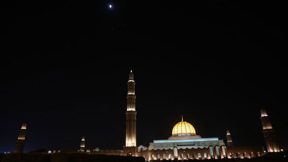 The moon above Sultan the Sultan Qaboos Grand Mosque in the Omani capital, Muscat [AFP]