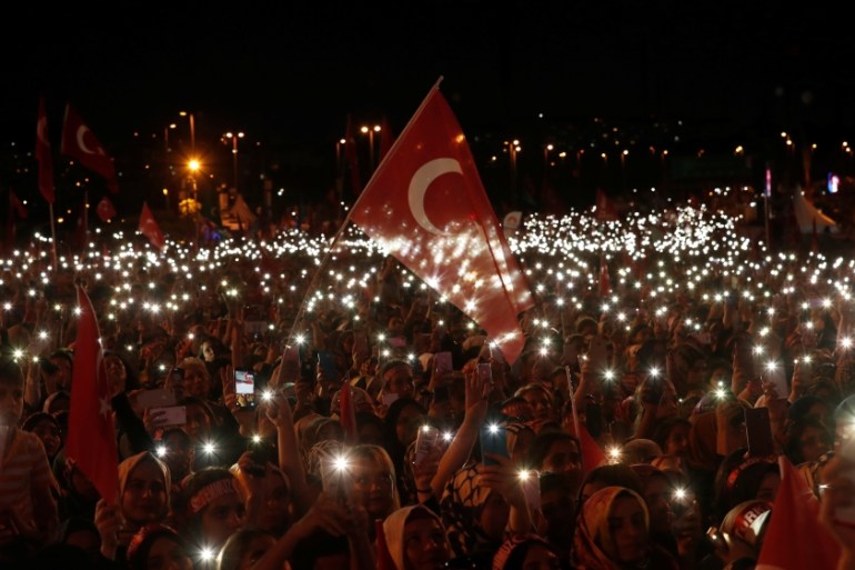 People attend a ceremony marking the second anniversary of the attempted coup at the Bosphorus Bridge in Istanbul