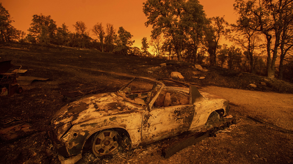 Many cars were scorched by the blaze [Noah Berger/AP]