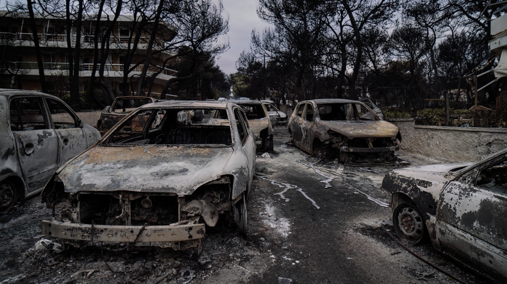 The streets of Mati were lined with burned-out cars after the fires swept through the village [Nick Paleologos/SOOC] 