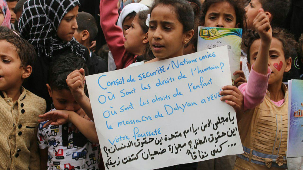 More than 100 children protested against the air strike in Sanaa on Sunday with placards calling on the UN to defend Yemeni lives [Courtesy of the AnsarAllah Media Center]