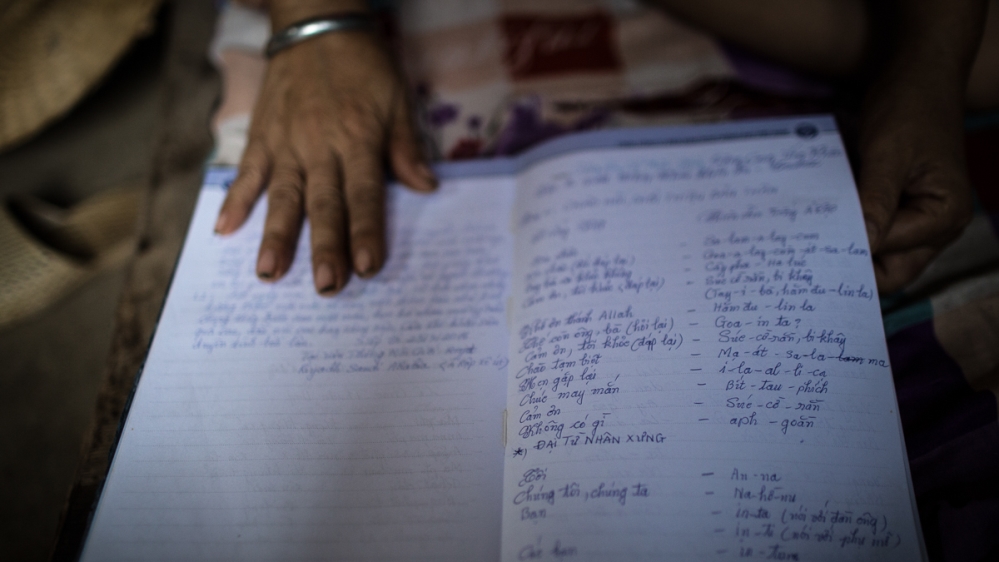 Dao shows notes from the Arabic lesson she took before her trip. Vietnamese domestic workers are entitled to classes on language, skills and culture but the sessions are poorly executed, say the workers [Yen Duong/Al Jazeera]