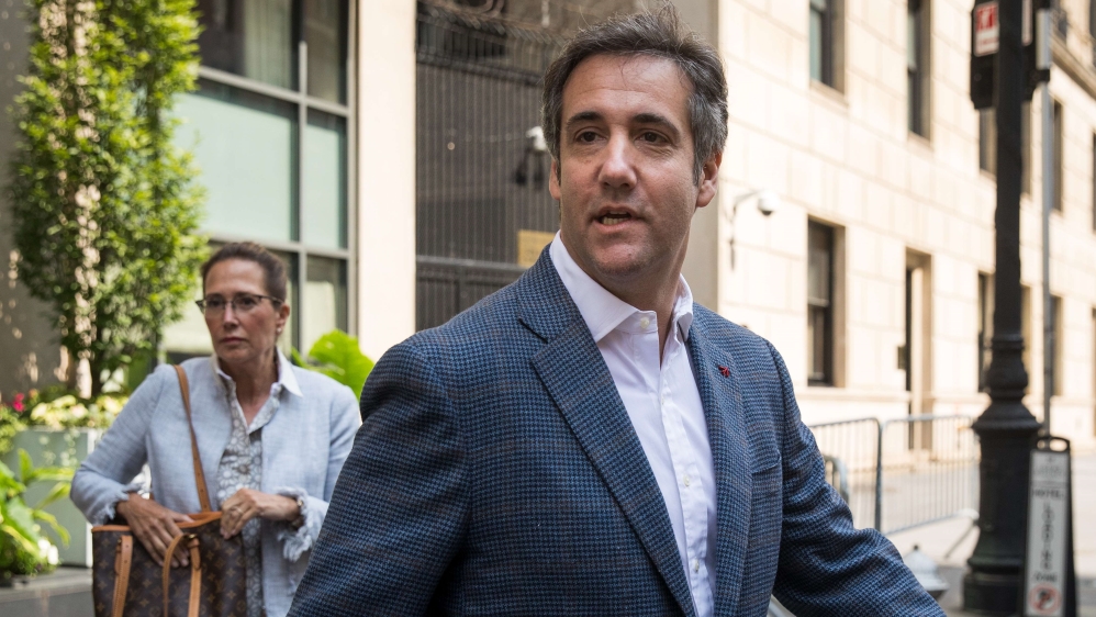 Michael Cohen, Trump's former lawyer, has pleaded guilty to breaking campaign finance laws and implicated the president [Drew Angerer/Getty Images/AFP]