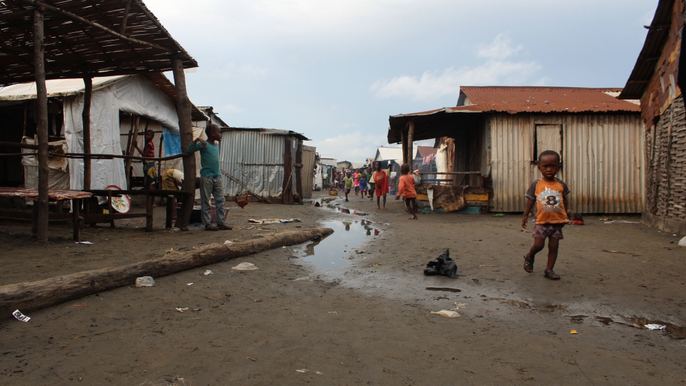A ribbon of water runs down one of Yelibuya’s main streets [Mara Kardas-Nelson/Al Jazeera]