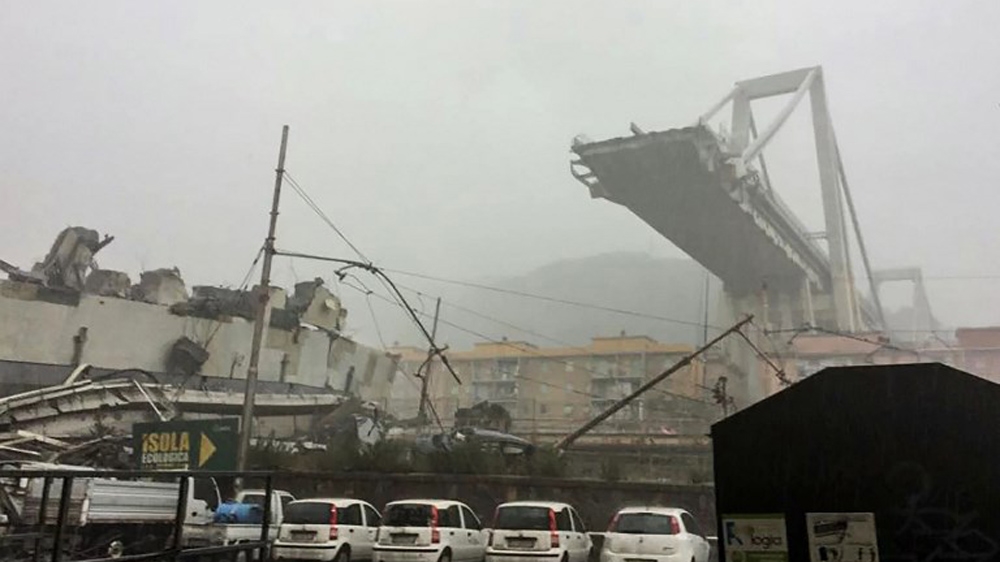 Italian media reports said about 200 metres of the bridge had fallen [Italian police via AFP]