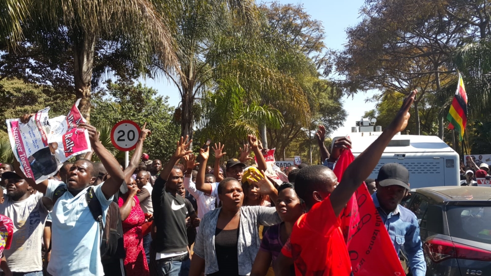 MDC supporters gathered outside of the vote tallying centre in Harare, Zimbabwe [Hamza Mohamed/Al Jazeera] 