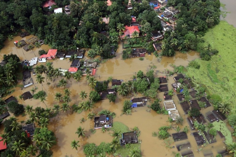 An aerial view shows partially submerged houses at a flooded area in the southern state of Kerala