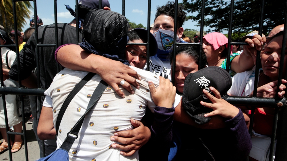 Relatives reunite with the students who were stuck inside a besieged church near the UNAN campus [File: Oswaldo Rivas/Reuters]