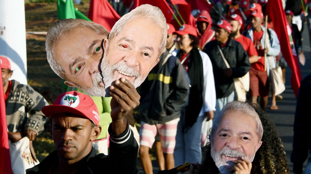 Members of the Landless Movement take part in the 'Free Lula' march near Brasilia [Evaristo SA/AFP] 