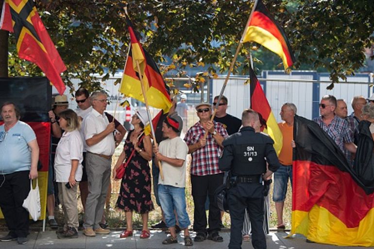 GERMANY-POLICE-MEDIA-FAR-RIGHT-PRESS This picture taken on August 16, 2018 in Dresden, eastern Germany, shows anti-Islam Pegida movement supporters demonstrating