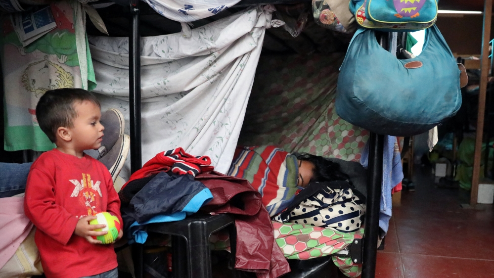 Venezuelan migrants at a temporary shelter in the San Juan de Lurigancho district of Lima [Guadalupe Pardo/Reuters]
