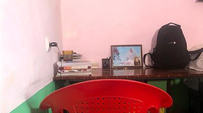 Rahila's desk where she used to study [Maisam Iltaf/Al Jazeera]