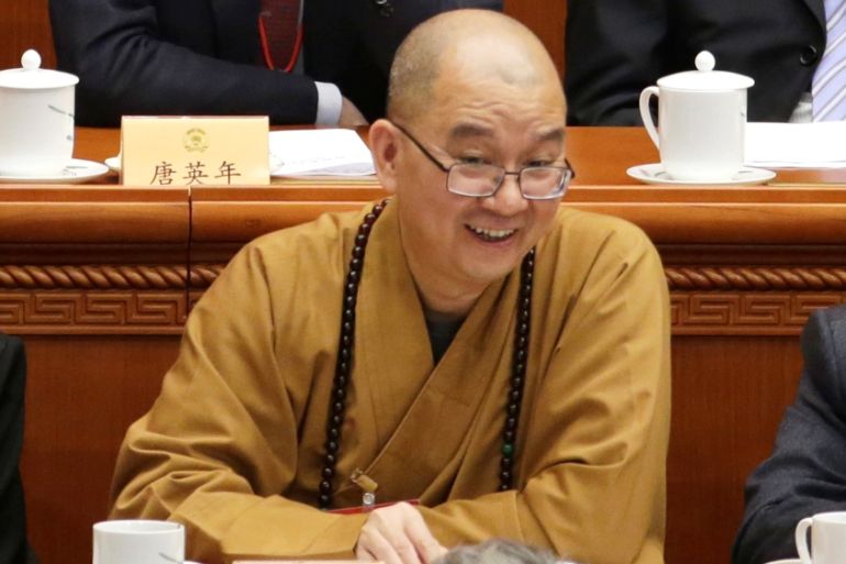 Xuecheng, the delegate of the CPPCC and the abbot of the Longquan Temple, attends an opening session of the CPPCC in Beijing