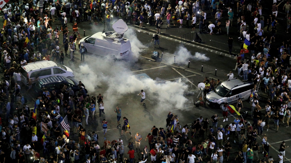 Police used water cannon and tear gas to disperse the protesters [Octav Ganea/Reuters]