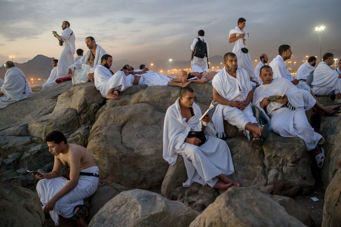 Muslim pilgrims pray on the Jabal Al Rahma holy mountain, or the mountain of forgiveness, at Arafat for the annual hajj pilgrimage outside the holy city of Mecca, Saudi Arabia, Monday, Aug. 20, 2018.