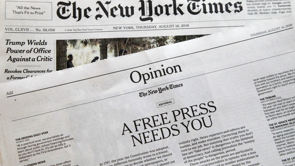 An editorial titled, A Free Press Needs You, is published in The New York Times [Mark Lennihan/AP Photo]