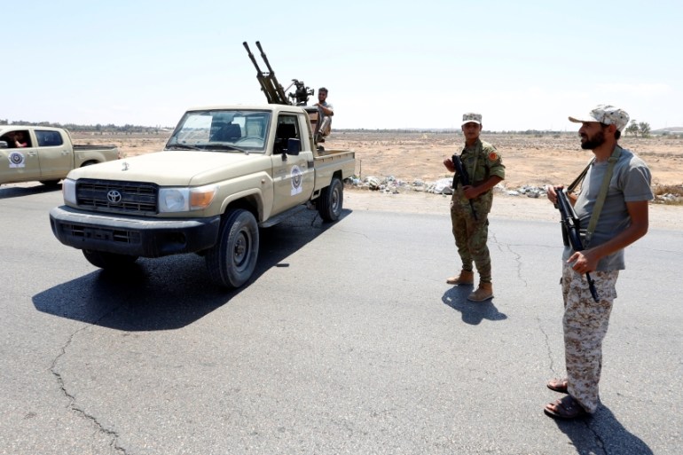 Soldiers are seen at a new checkpoint located near to the Kaam checkpoint after a gun attack in Zliten
