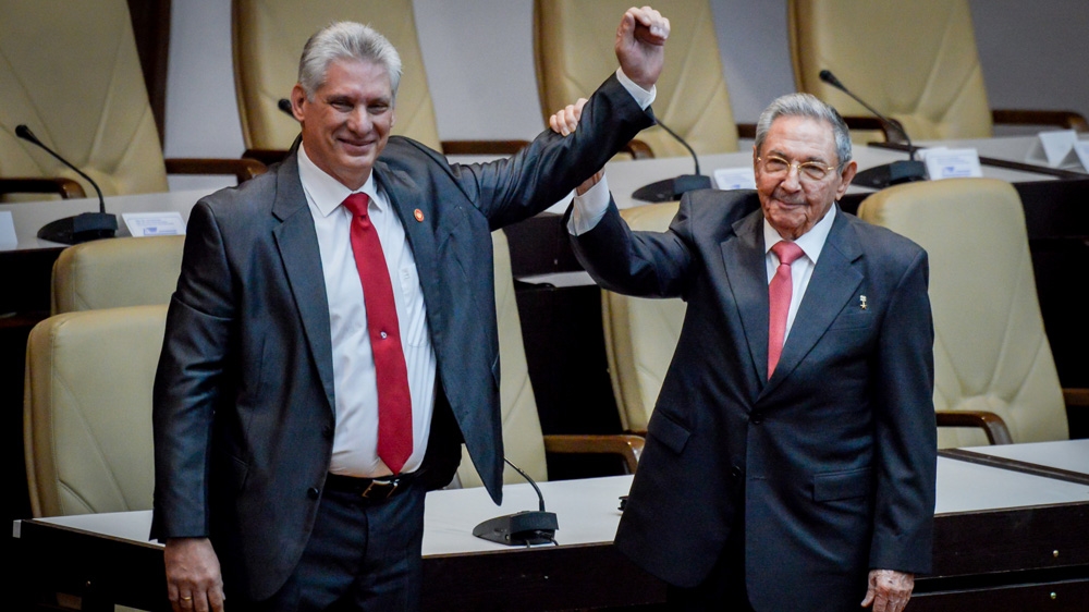 Miguel Diaz-Canel (left) took over from Raul Castro (right) in April, becoming the first non-Castro to lead Cuba since the revolution [File: Adalberto Roque/Reuters]
