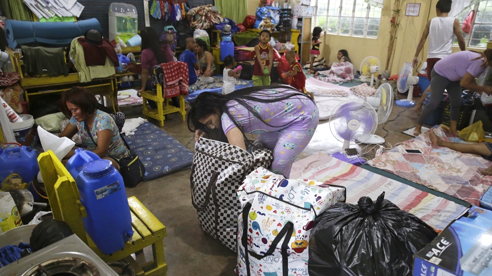 Thousands of residents from low-lying areas in the northern Philippines have evacuated [AP]