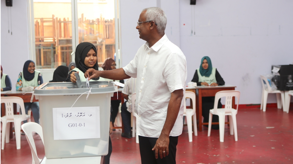 Opposition candidate Ibrahim Mohamed Solih voted soon after polling stations opened [Sharif Ali/Al Jazeera]
