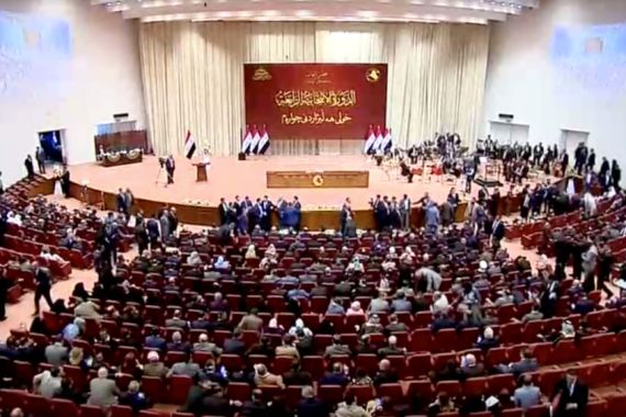 Iraqi lawmakers are seen before opening session of the new Iraqi parliament in Baghdad