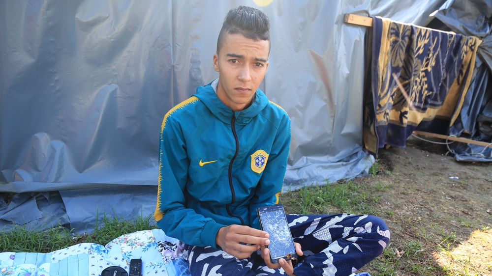Muhammad Burada, 16, from Morocco says Croatian police broke four of his mobile phones and beat him with a baton. 'Everyone here has been beaten. Each officer is like a monster,' he says [Mersiha Gadzo/Al Jazeera]