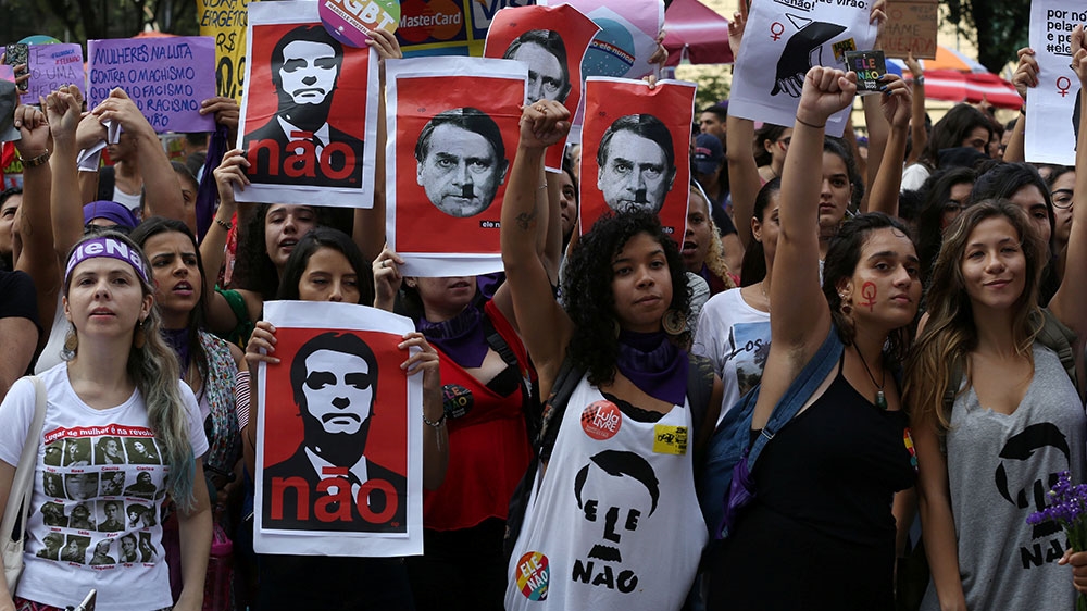 People demonstrate against presidential candidate Jair Bolsonaro in Rio de Janeiro, Brazil [File: Ana Carolina Fernandes/Reuters]